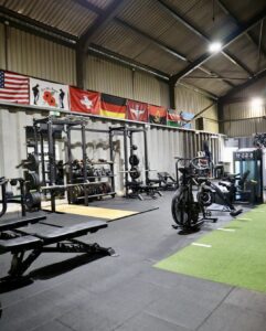 bike, weights, mirror, platform, bench, flags