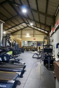 bike, weights, mirror, platform, bench, flags, treadmill